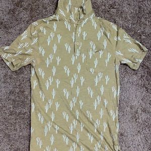 Tan shirt with Cactuses on it